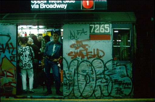 New York City, NYS, USA, July 5, 1979. Subway train in upper west side with overgrown wagon and graffiti.