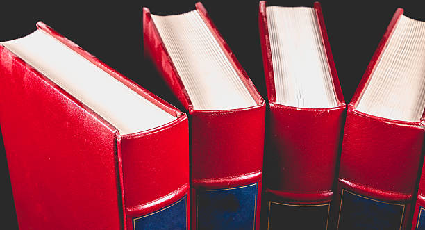 old encyclopedias on black background - book law instruction manual old imagens e fotografias de stock