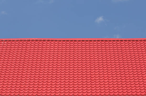 istock red roof with blue sky 636803772