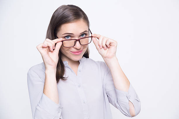 istock Sophisticated young woman adjusting glasses 636805324
