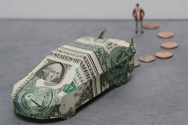 istock car made of dollers with coins 636806584