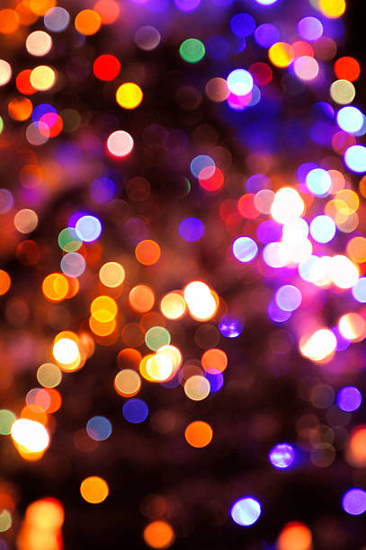 luces multicolores desenfocadas - colors heat abstract christmas fotografías e imágenes de stock