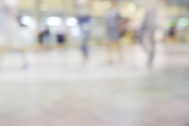 istock city people crowd abstract background blur action 636807136