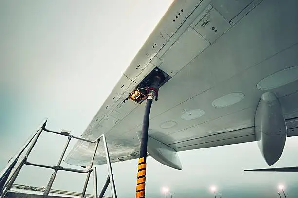 Process of the refueling passenger plane at the airport