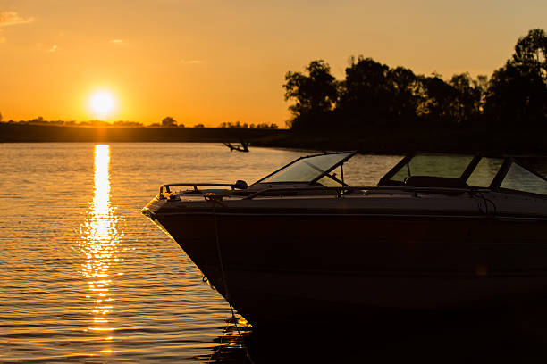 boat silhouette at sunset near the shore