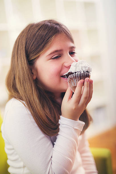 istock Girl eating a chocolate cake 636814794
