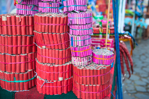 Stall on the street with stacks of different collections of fireworks.