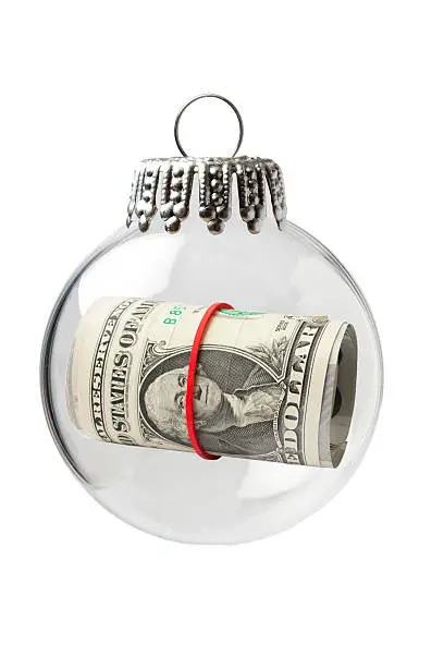 Photo of US Paper Currency in a Christmas Ornament