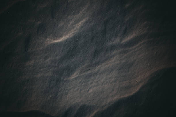 istock The background of the dark snow texture 636818138