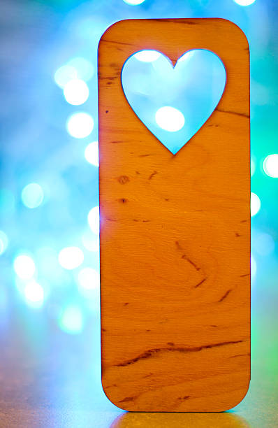 istock Wooden heart over bokeh background 636819948
