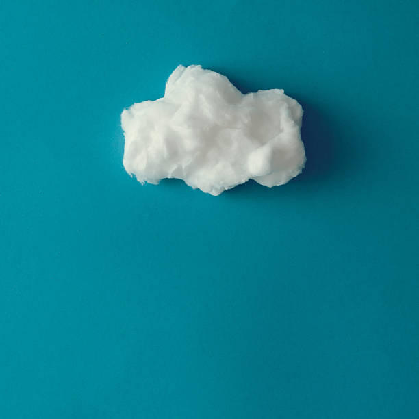 istock Cloud made out of cotton wool on blue background. 636820650