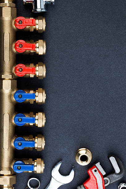 Brass manifold valve and wrenches. stock photo