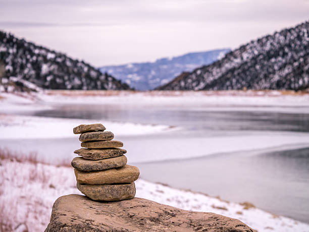 istock Rock Cairn in Front of Frozen Lake 636823596