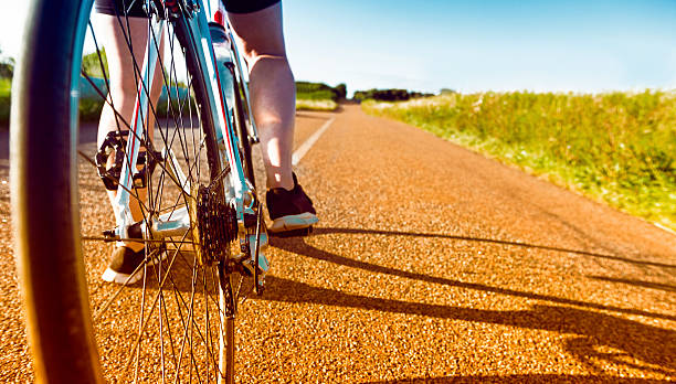 istock Bicycle ready to move forward on long country road 636829208