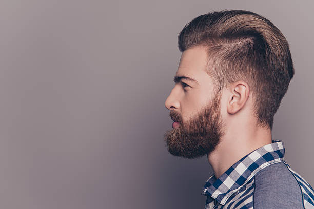 istock Side view portrait of handsome stylish young man with beard 636829520