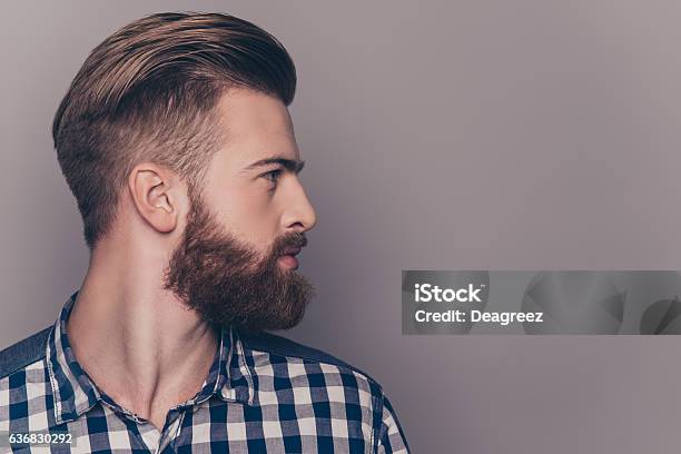 Side View Portrait Of Thinking Stylish Young Man Looking Away Stock Photo - Download Image Now