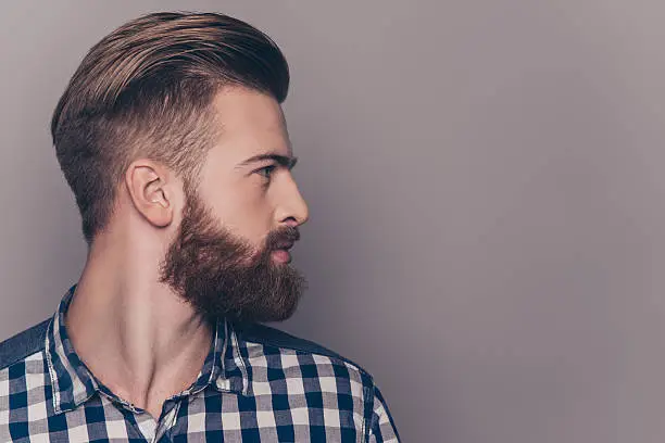 Photo of Side view portrait of thinking stylish young man looking away