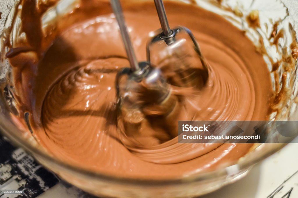 mixing ingredients with electric mixer to make cookies Chocolate Stock Photo