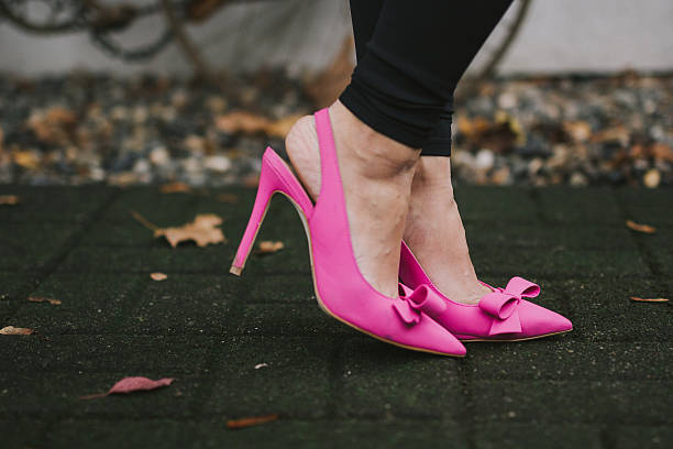 istock Woman Wearing Pink Stilettos 636833914