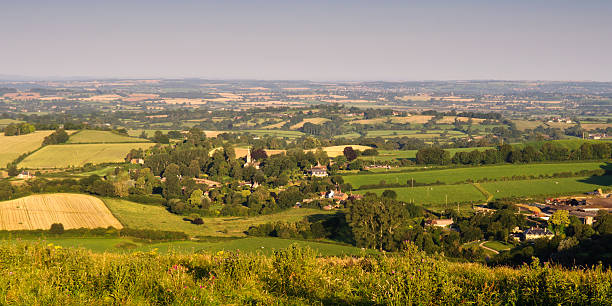 Fontmell Hill Agricultural fields and pasture of the Blackmore Vale seen from Fontmell Down in North Dorset, England. blackmore vale stock pictures, royalty-free photos & images