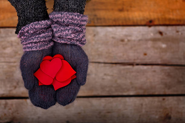 many red hearts in hands - glove winter wool touching imagens e fotografias de stock