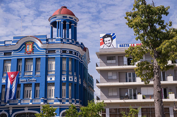 Camaguey, Cuba on January 3, 2016: Buildings in Camaguey, Cuba with Che Guavera poster and Cuban flag symbolizing the Cuban revolucion
