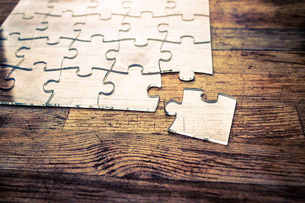 Transparent Jigsaw puzzle on wood background