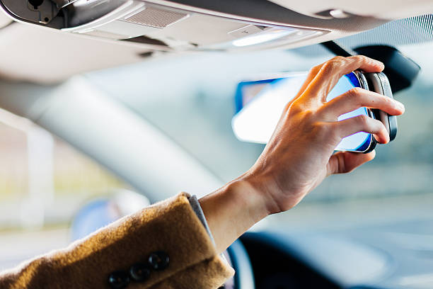 istock man's hand and panel of car 636845554