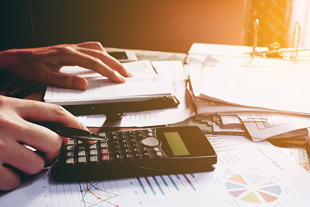 istock Close up man doing finance and using calculator 636846994