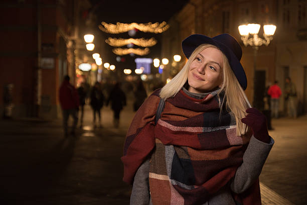 istock young smiling girl outdoors winter street night 636850180