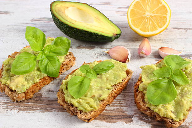 istock Freshly sandwiches with paste of avocado and ingredients 636850890