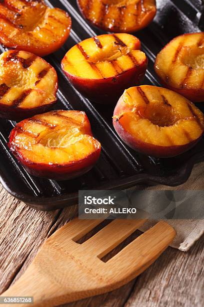 Summer Dessert Cooking Ripe Peaches On A Grill Pan Closeup Stock Photo - Download Image Now