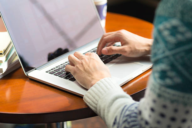 istock young asian man studying with laptop 636854402