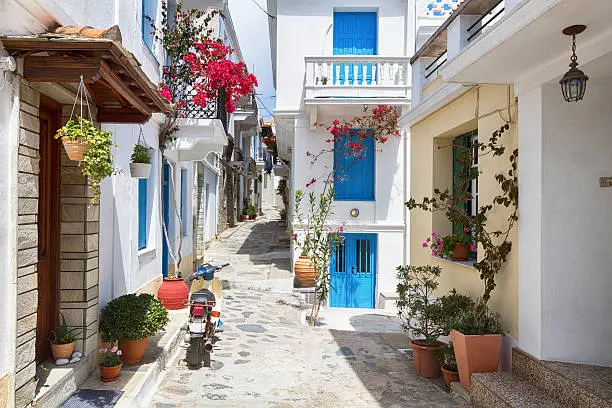 Tiny colorful Greek streets with flowers