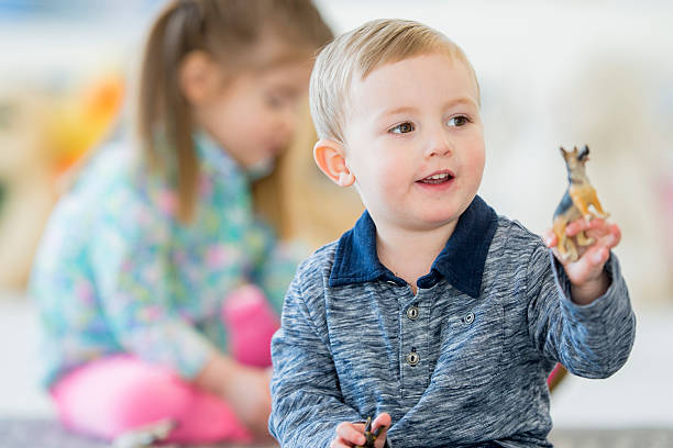 istock Little Boy Playing with Toys 636856640