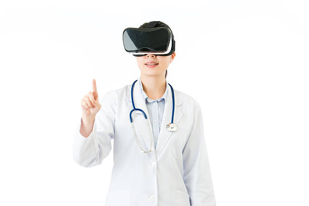 istock asian female doctor touch screen by VR headset glasses 636858064
