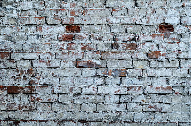 istock Texture of old red brick wall surface with cement 636859374