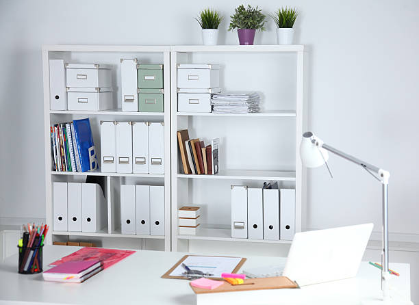 istock Modern office interior with tables, chairs and bookcases 636860414
