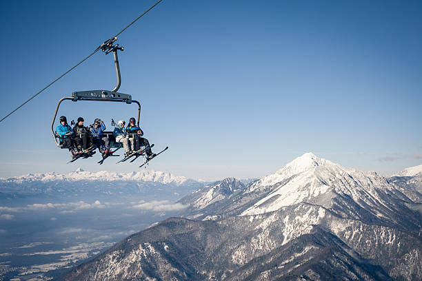 Group of skiers on a ropeway stock photo