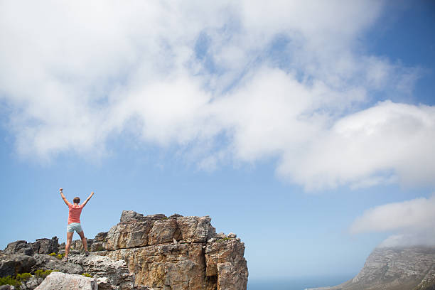 istock Female hiker celebrates her successful hike! 636864628
