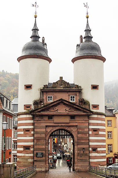Heidelberg, Germany - November 8, 2016: View from Heidelberg Old Bridge onto Old Town with cars and people through bridge gate