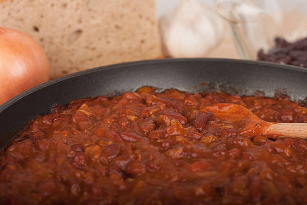 istock Chili Con Carne in pan on wooden table 636865780