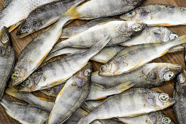 istock Dried fish on wooden background 636866664