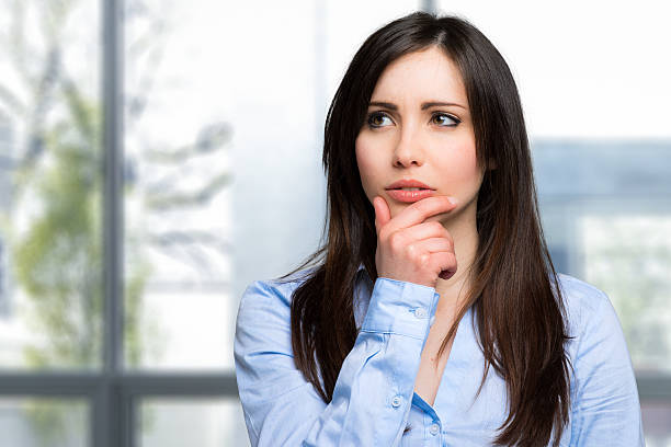 istock Beautiful pensive woman 636871776