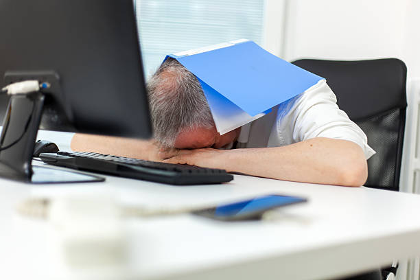 istock Bored businessman full of work 636871838