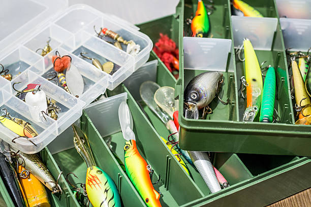 istock Fishing spoon baits, lures, flies, tackles in box 636876550