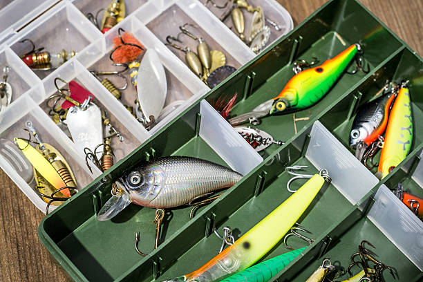 istock Fishing spoon baits, lures, flies, tackles in box 636876642