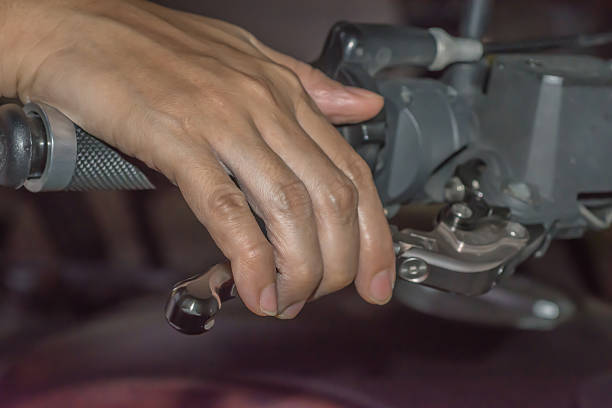 istock women's hand on wheel motorcycle 636876792