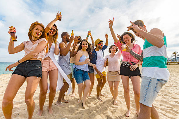 istock Group of Friends Enjoying a Fun Beach Party 636876922