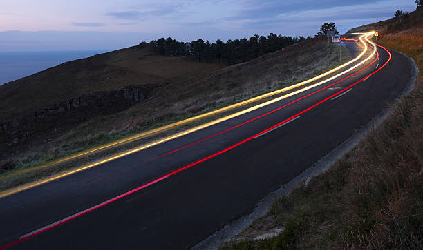 istock Car lights, driving at night speed 636877614